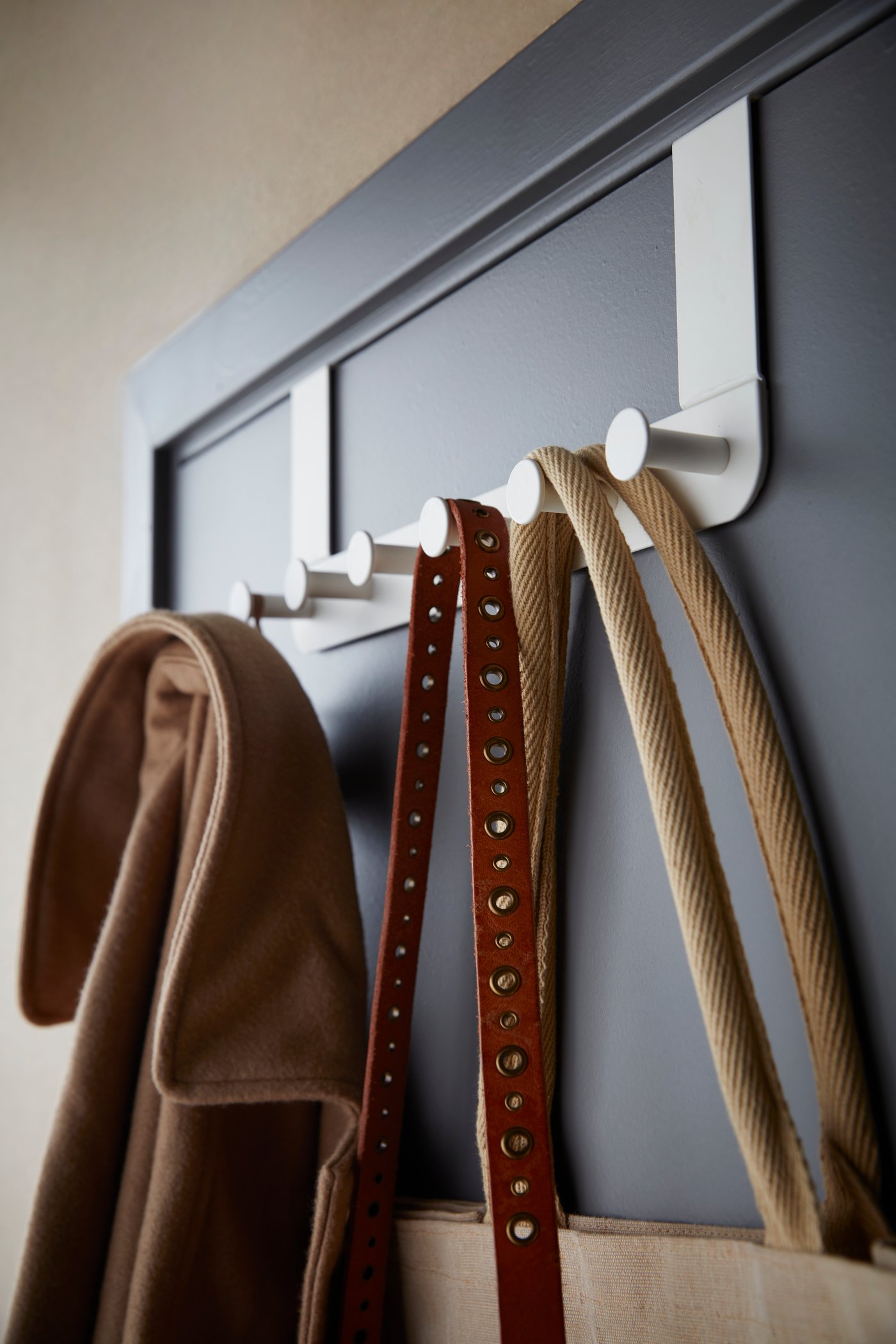 A white ENUDDEN hanger for door in the bedroom