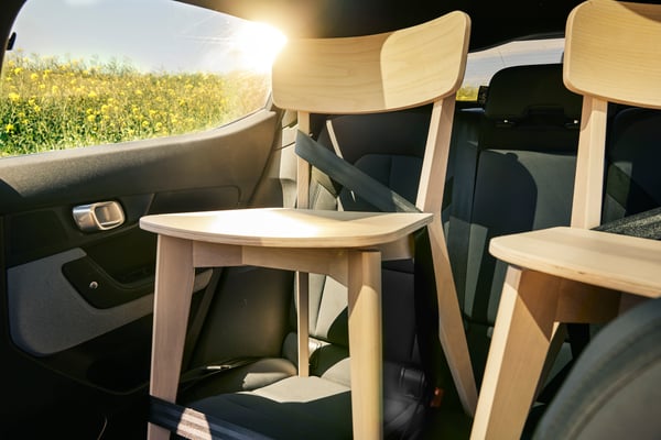 An IKEA LISABO dining chair strapped in the back of a car
