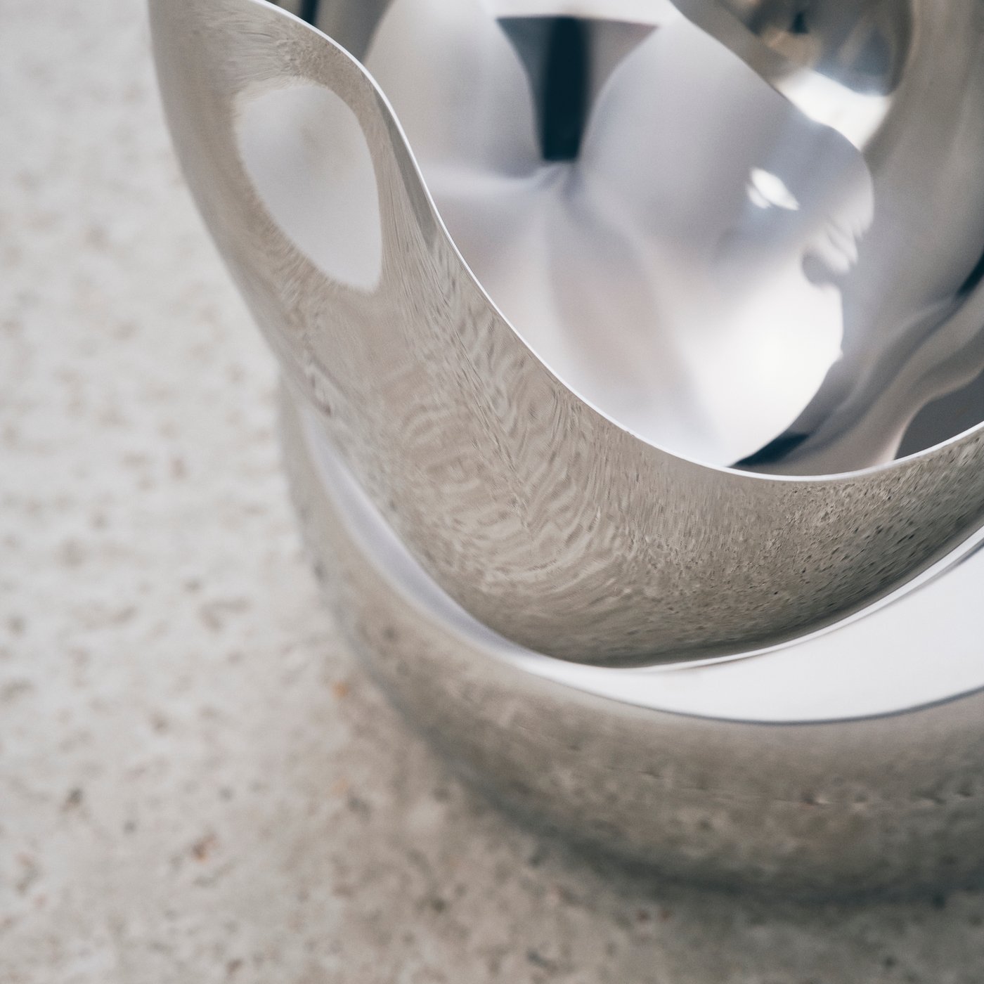 Close up of a part of a shiny bowl that is part of the IKEA KONSTRUNDA art collection.