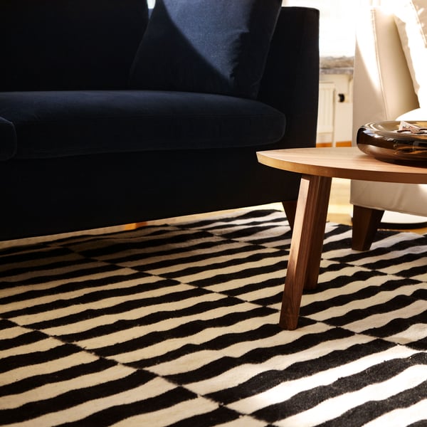 A handmade/striped black/off-white STOCKHOLM rug, flatwoven