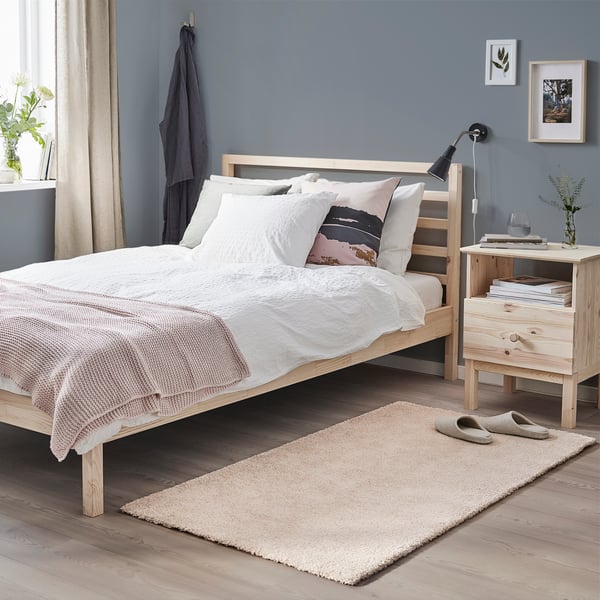 An off-white STOENSE rug, low pile