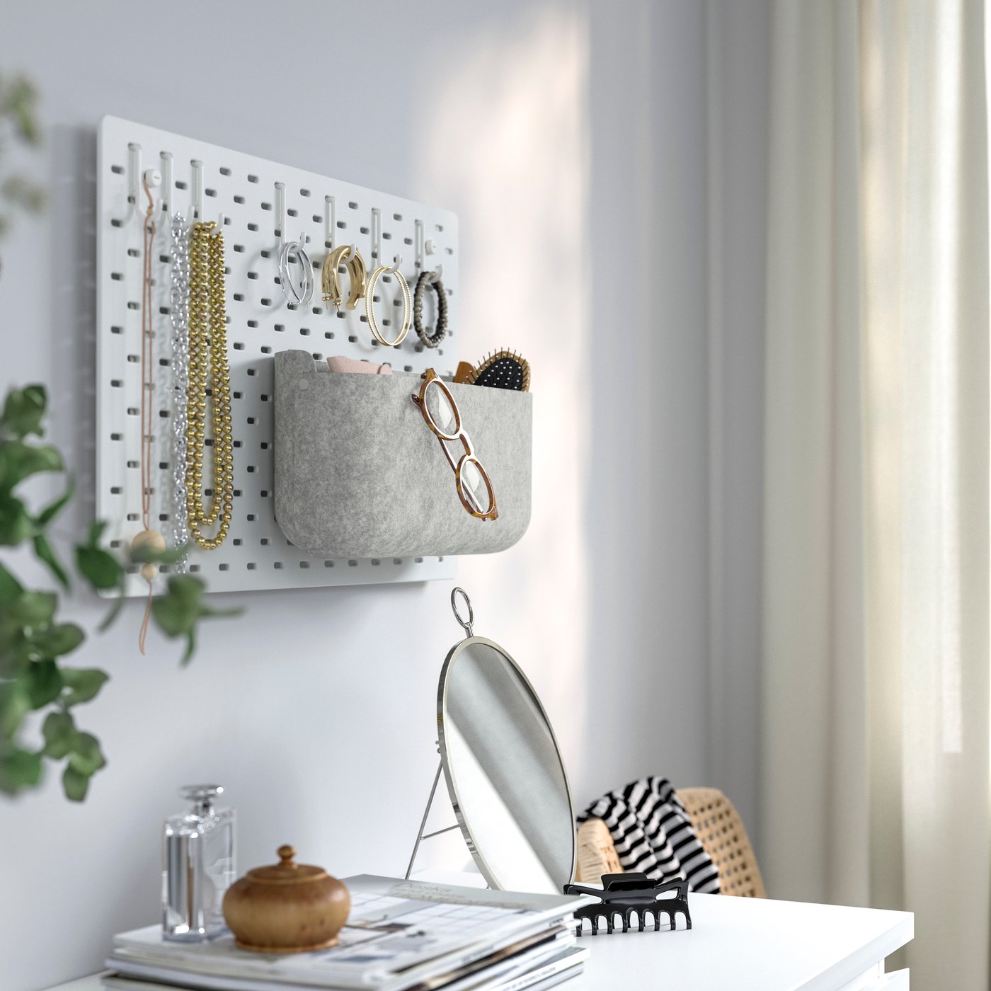 A grey SKÅDIS storage basket