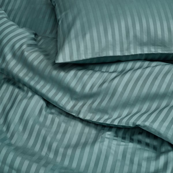 A blue-green NATTJASMIN duvet cover and pillowcase