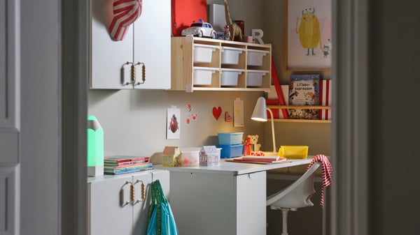 A white LÄRANDE desk with pull-out storage unit