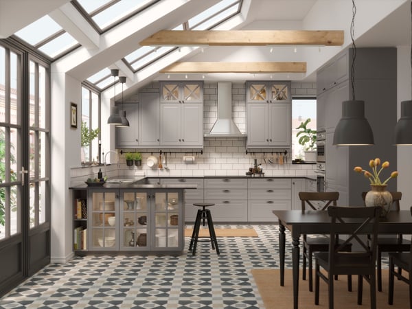 A stainless steel FÖLJANDE wall mounted extractor hood in the kitchen