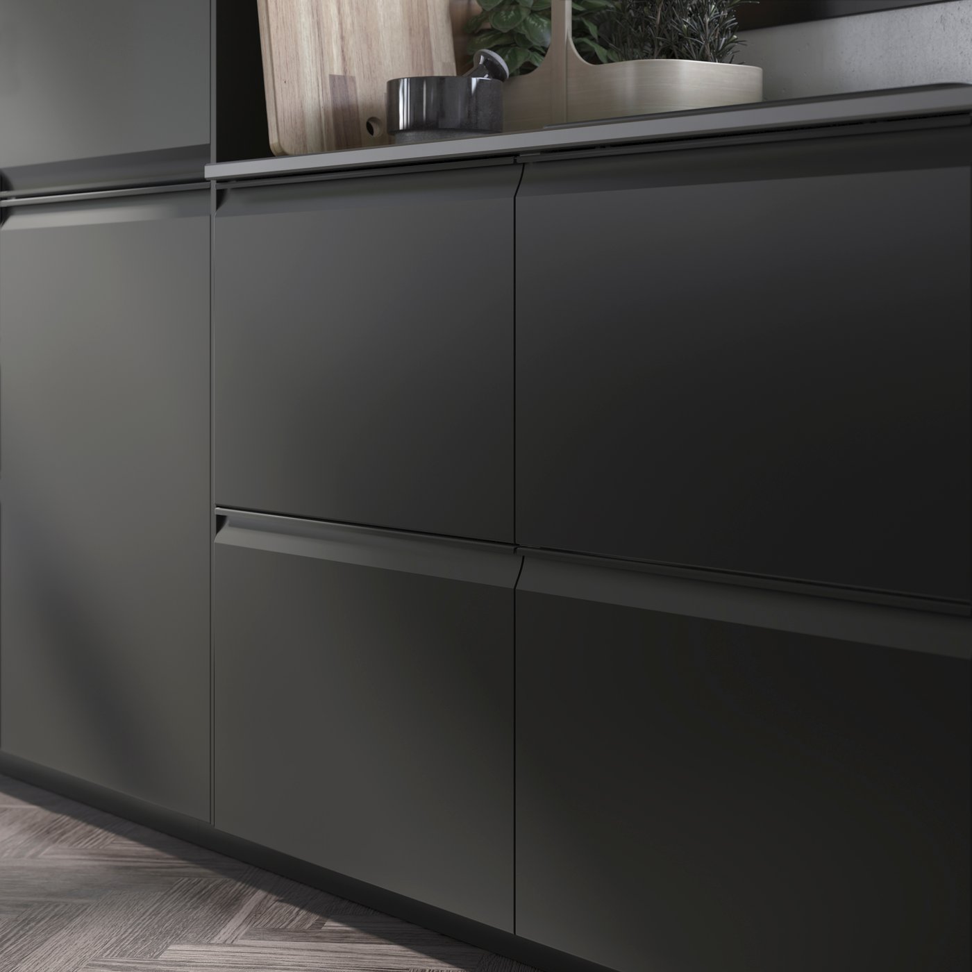 A handleless matt anthracite-coloured UPPLÖV drawer front.

