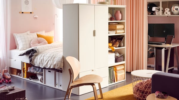 A student room with a white PLATSA bed-storage combination