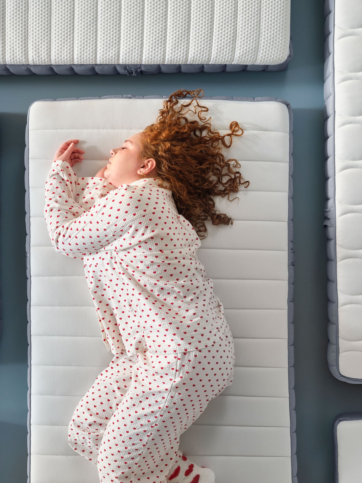 A firm/light blue VALEVÅG pocket sprung mattress