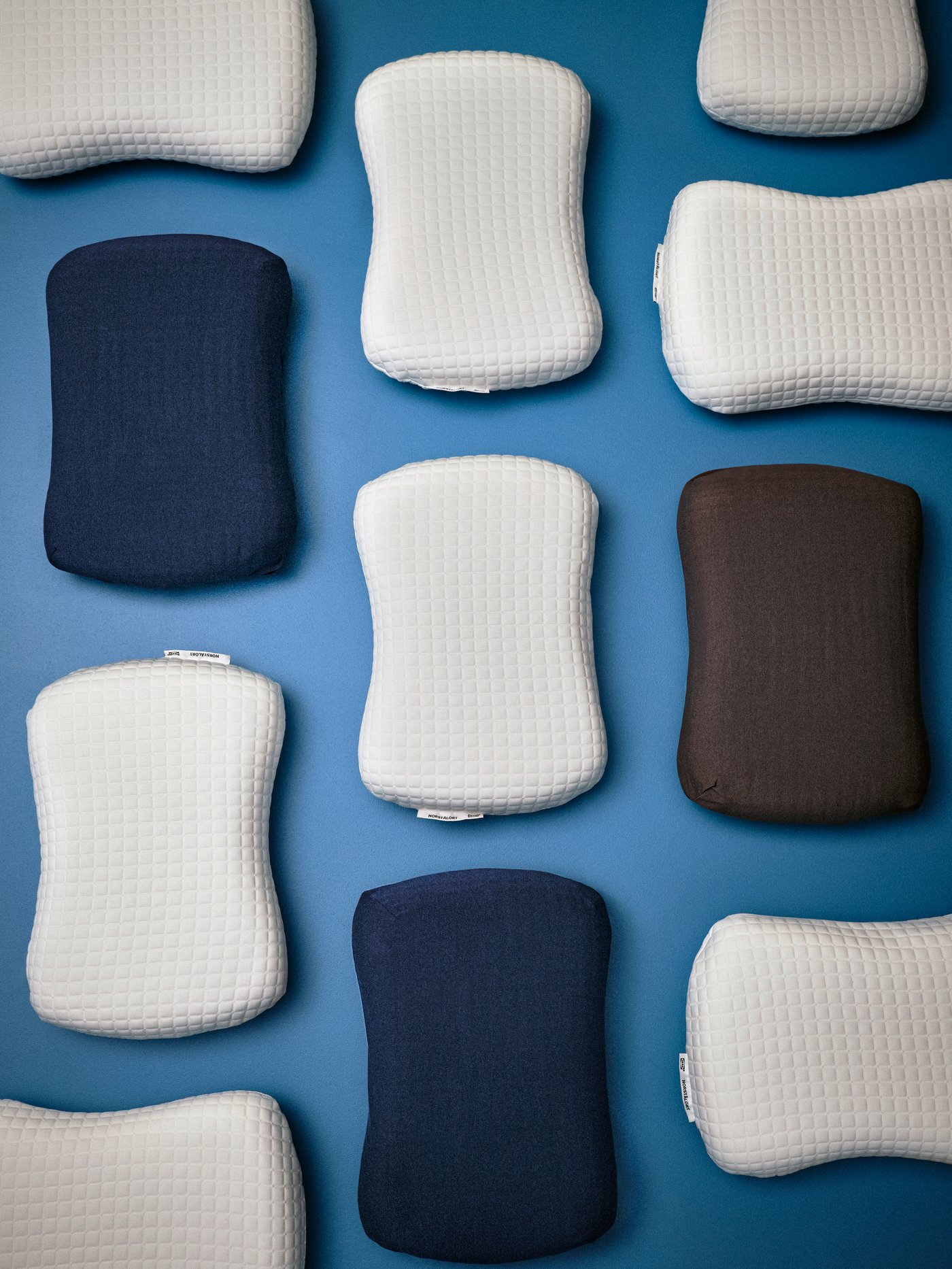 A dark blue TÖCKENFLY pillowcase for ergonomic pillow