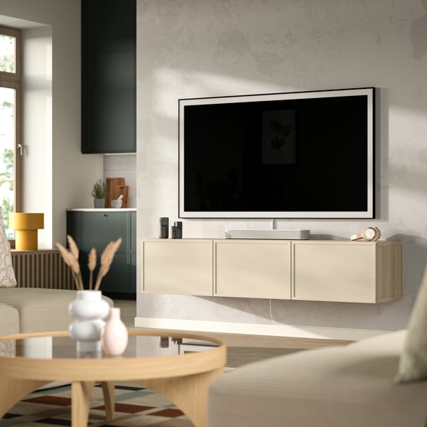 A white stained oak effect/Krukmakare beige BESTÅ TV bench with doors in the living room