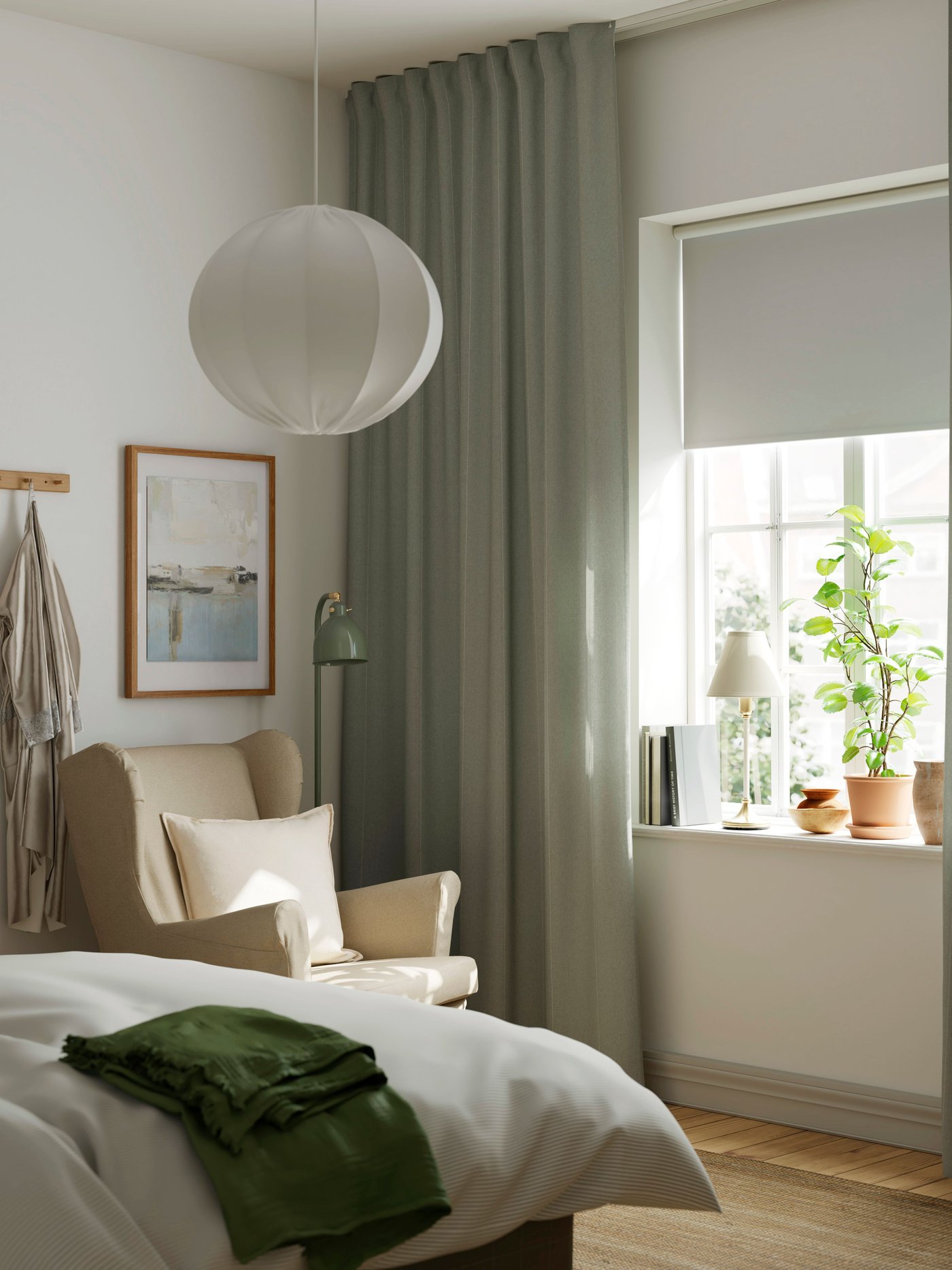 A white REGNSKUR pendant lamp in the bedroom