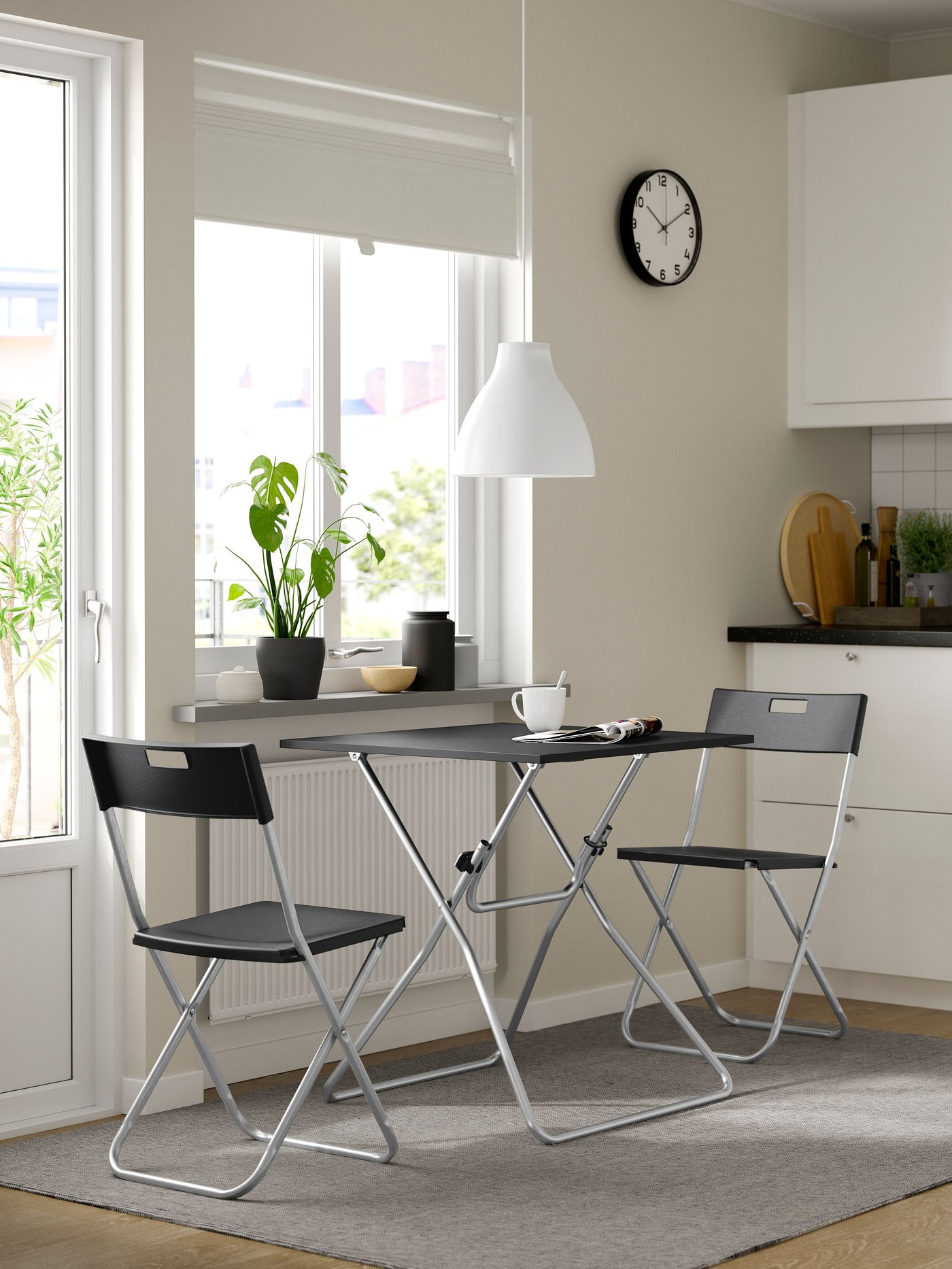 A black GUNDE folding table