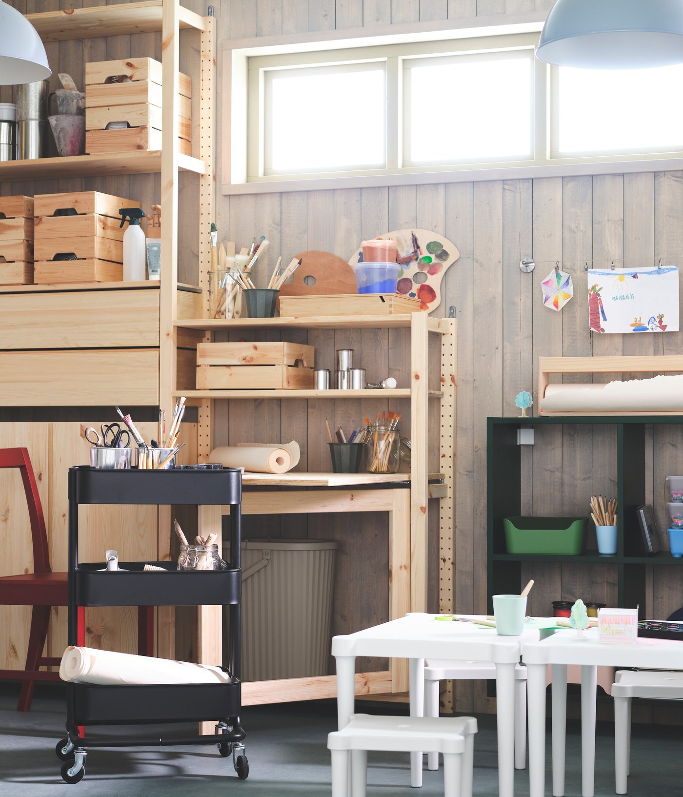 An in/outdoor/white UTTER children's table in the garage
