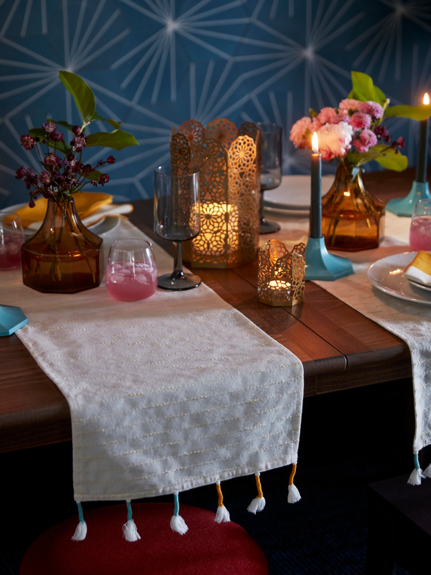 A blue GOKVÄLLÅ candlestick/candle holder