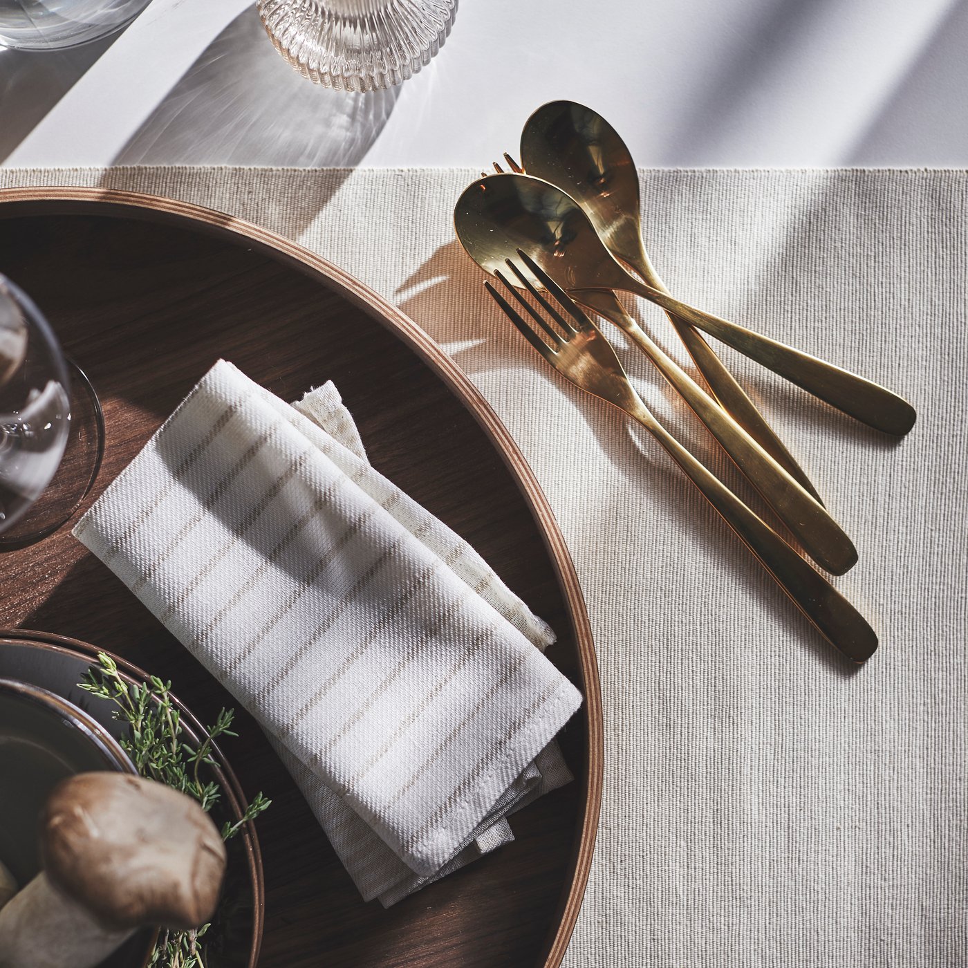 A striped light beige/off-white SILVERARV napkin