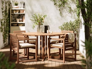 A light brown stained NÄMMARÖ table, outdoor.