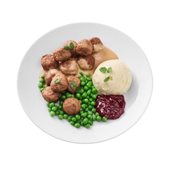 Un piatto con polpette VegeTali e Quali, piselli, purè di patate e salsa ai mirtilli
