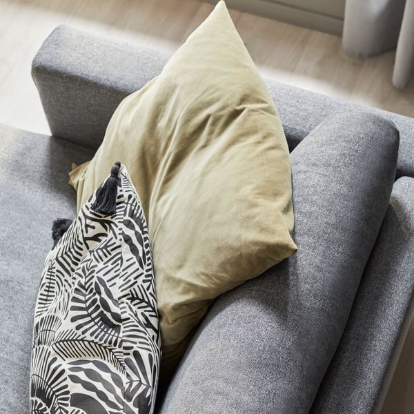 A corner of a VIMLE grey sofa shoot from above, with two decorative cushions.