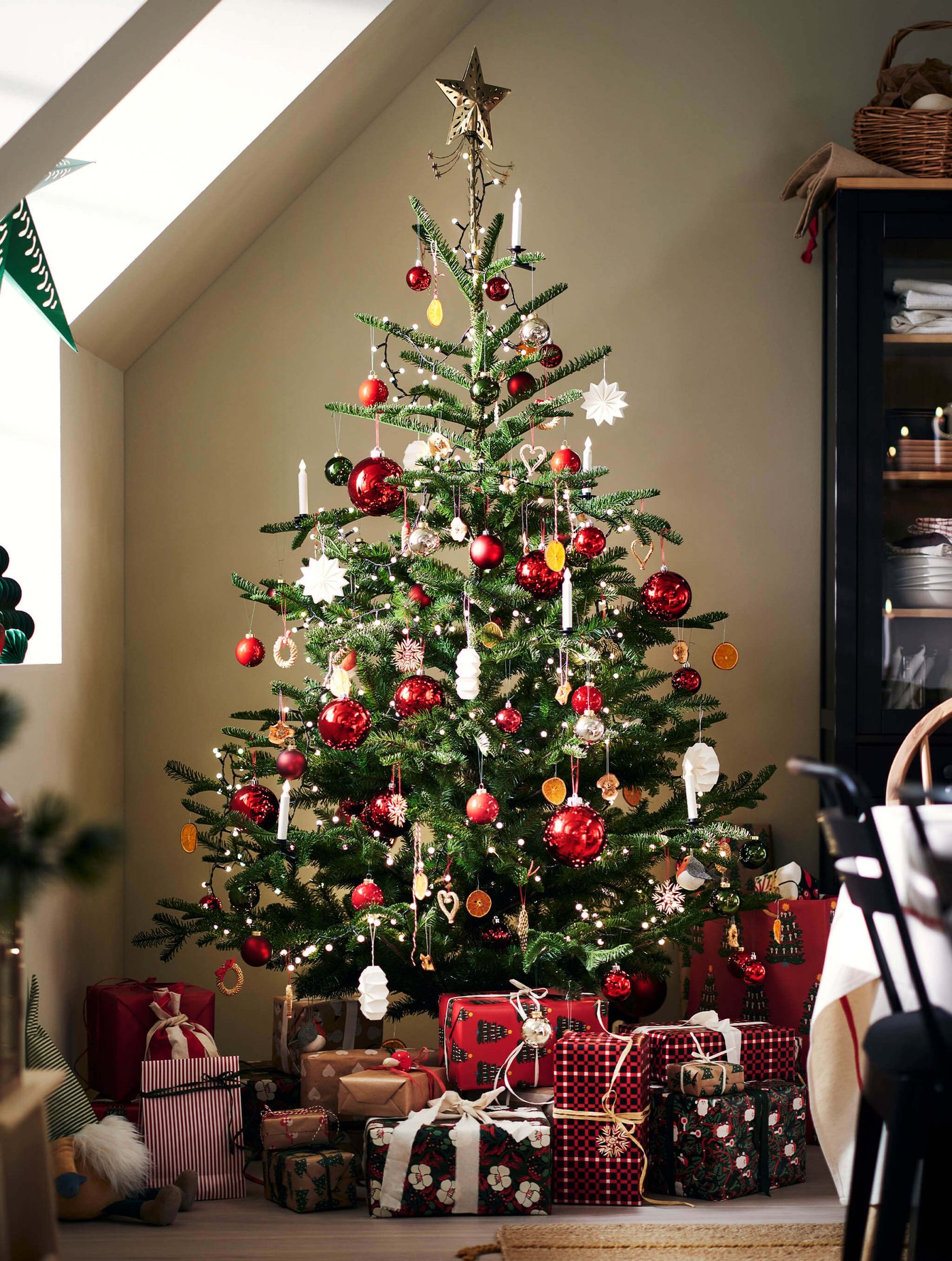 Christmas tree decorated with different baubles and ornaments
