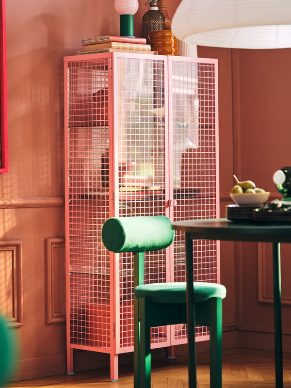 A light pink IKEA PS 2026 glass-door cabinet