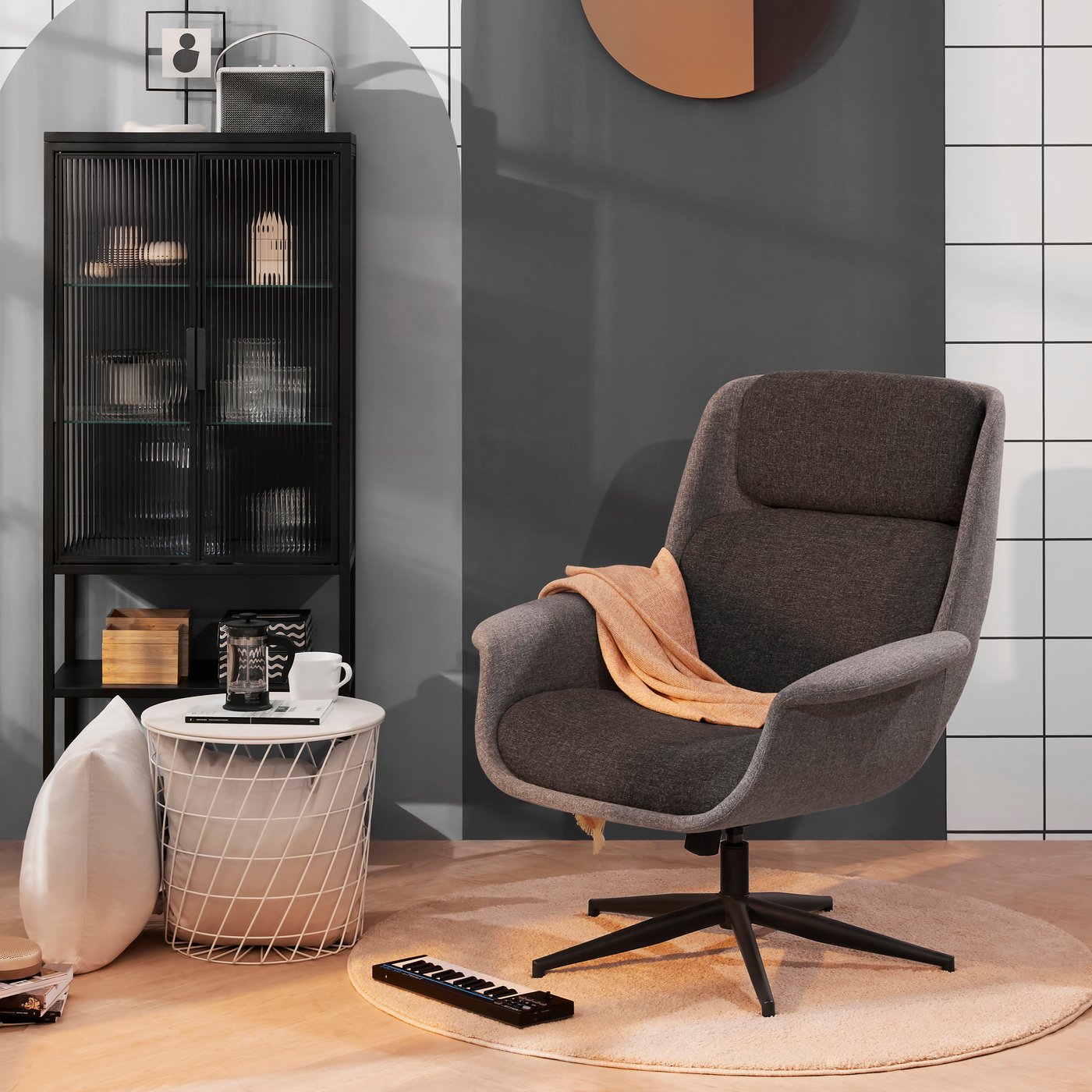 A Gunnared medium grey/dark grey ÄLEBY swivel armchair in the living room