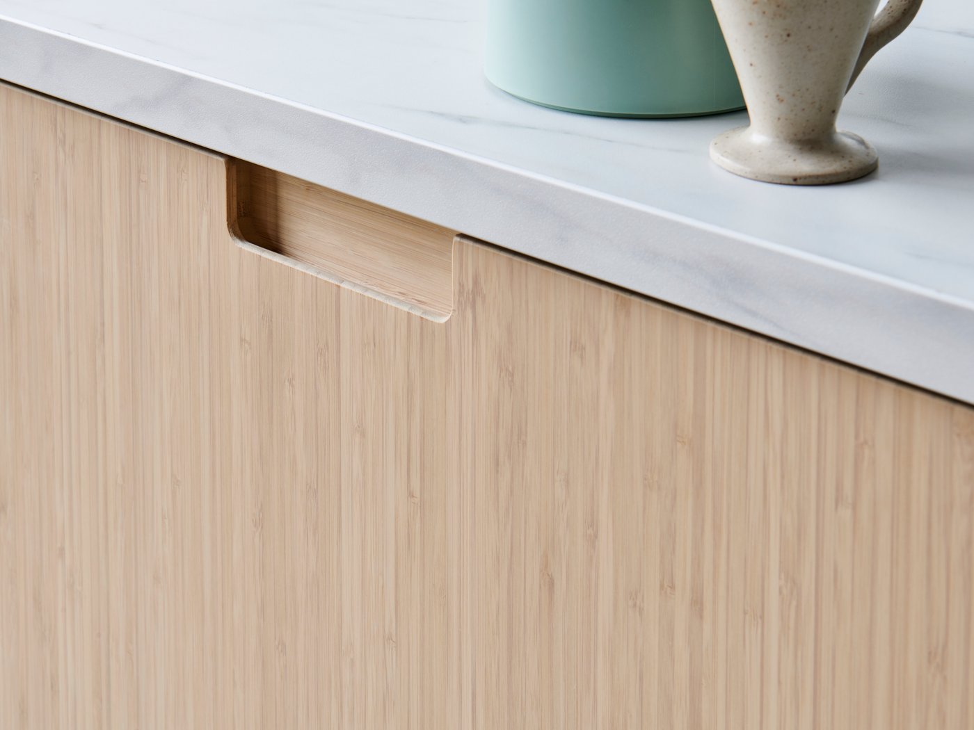 A white marble effect/laminate EKBACKEN worktop in the kitchen