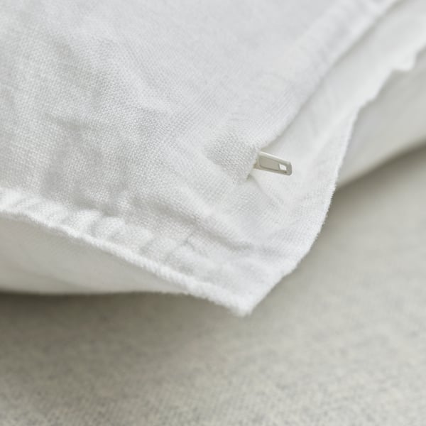 A white DYTÅG cushion cover