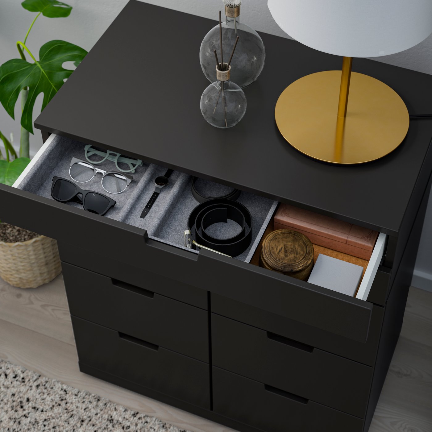An anthracite NORDLI chest of 8 drawers in the bedroom