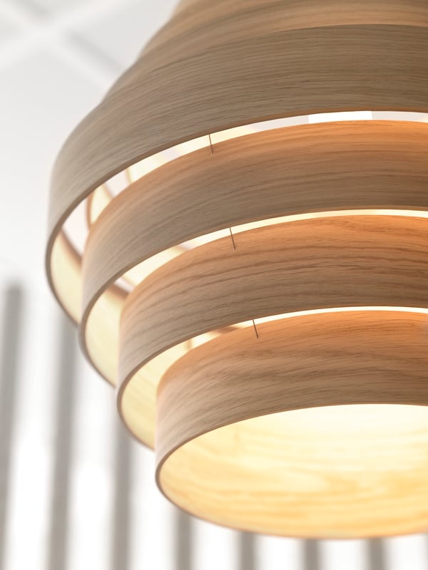 The detailing of the rings of the DYKARKLOCKA pendant lampshade in lacquered oak.