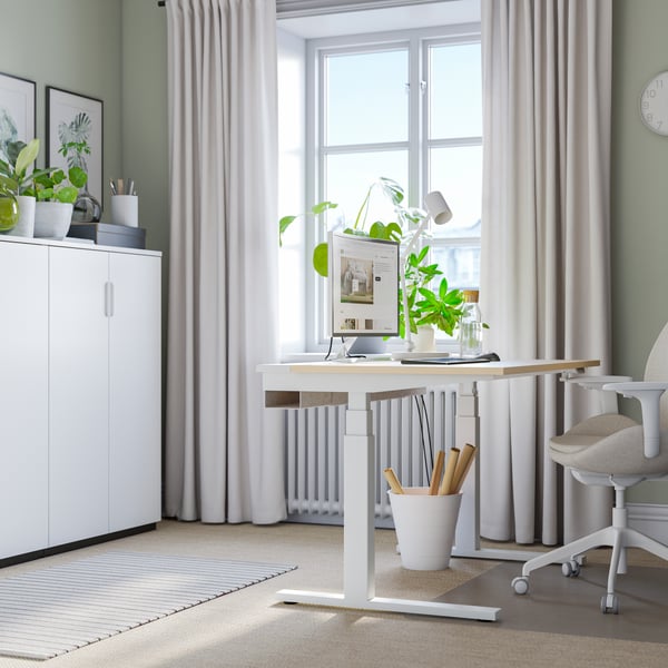 An electric birch veneer/white MITTZON desk sit/stand