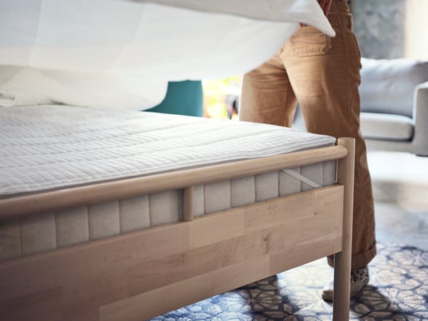 A grey/beige HUNDSLUND rug flatwoven, in/outdoor in the bedroom