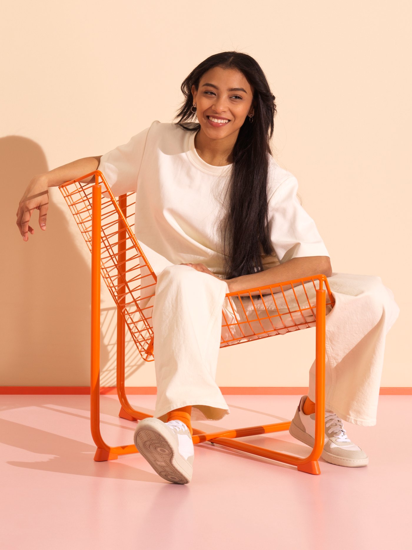 An orange SKÅLBODA armchair