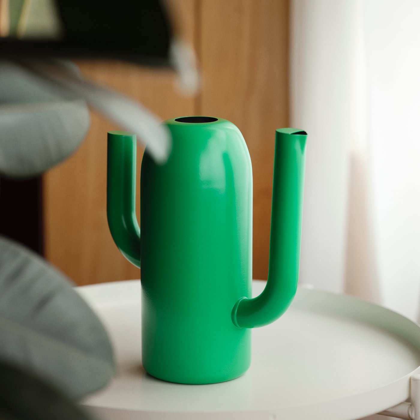 A bright green ÄRTBUSKE vase/watering can