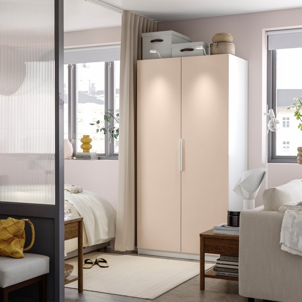A white/high-gloss light orange FARDAL wardrobe combination