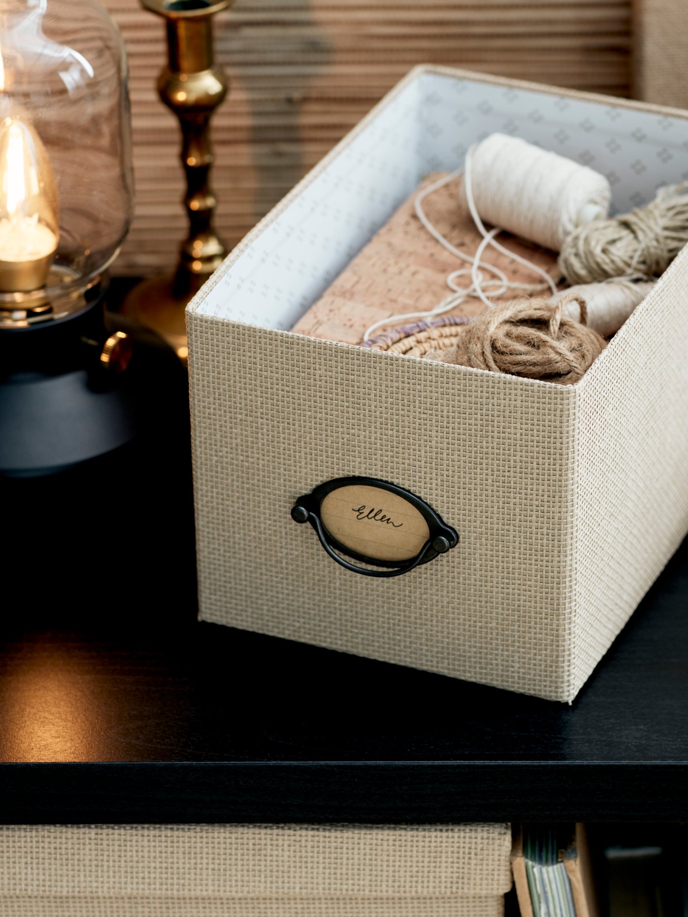 A beige KVARNVIK storage box with lid in the home office