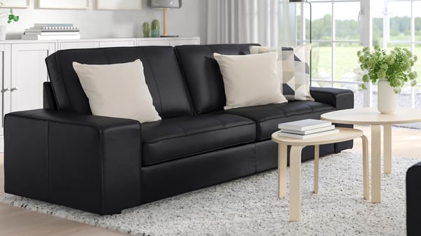 A large living room featuring a dark sofa.