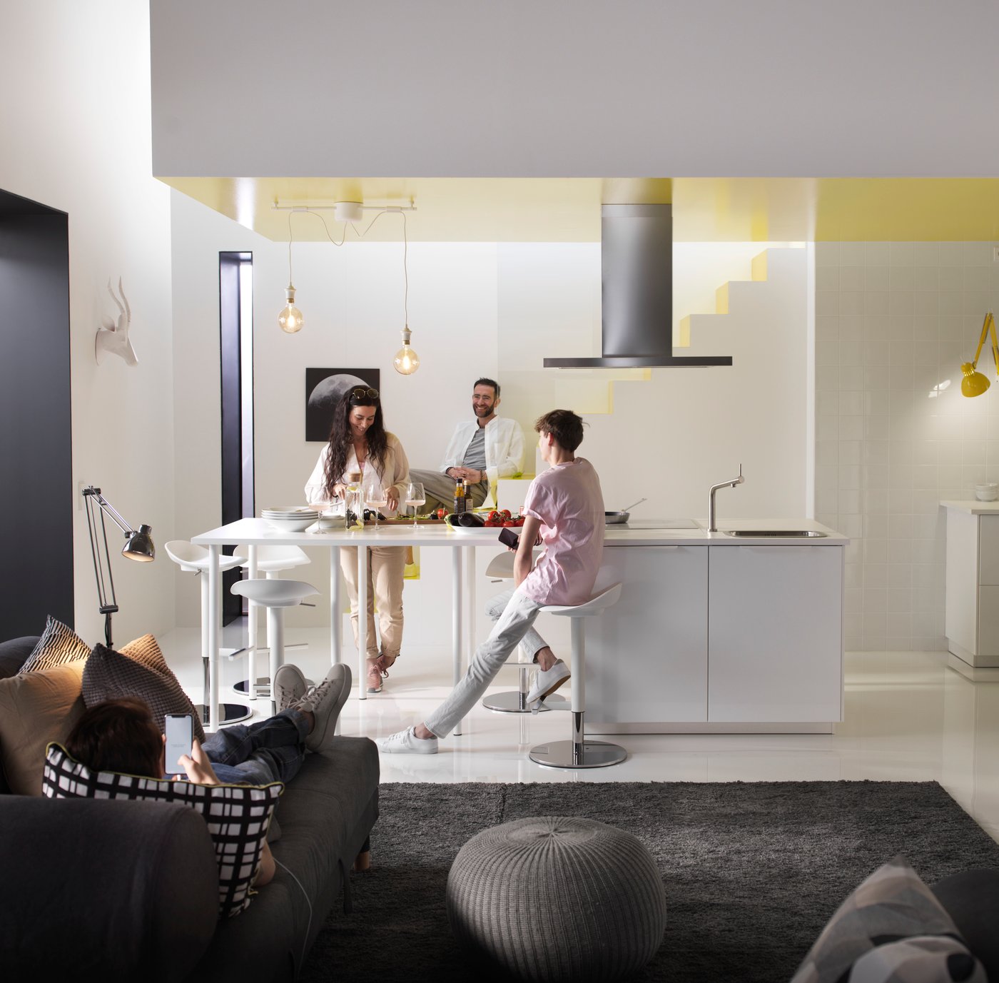 A stainless steel SVÄVANDE ceiling-mounted extractor hood in the kitchen