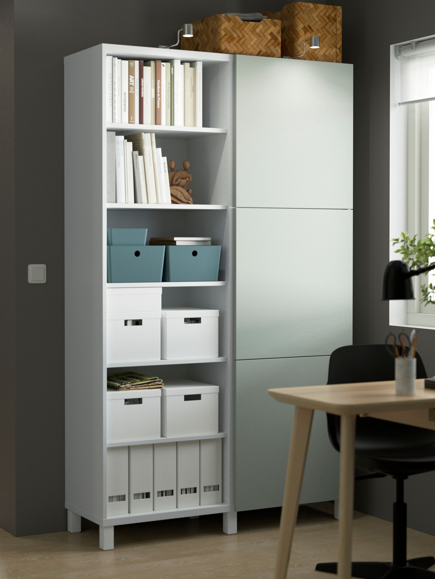 A white/Hjortviken pale grey-green BESTÅ storage combination with doors.