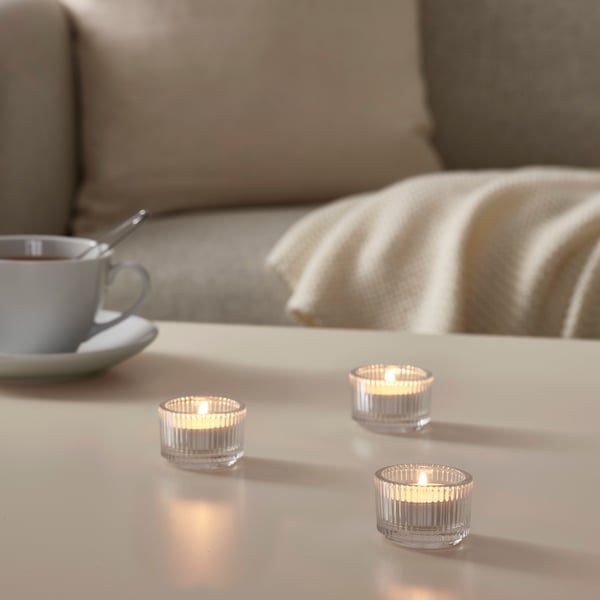 A clear glass FINSMAK tealight holder