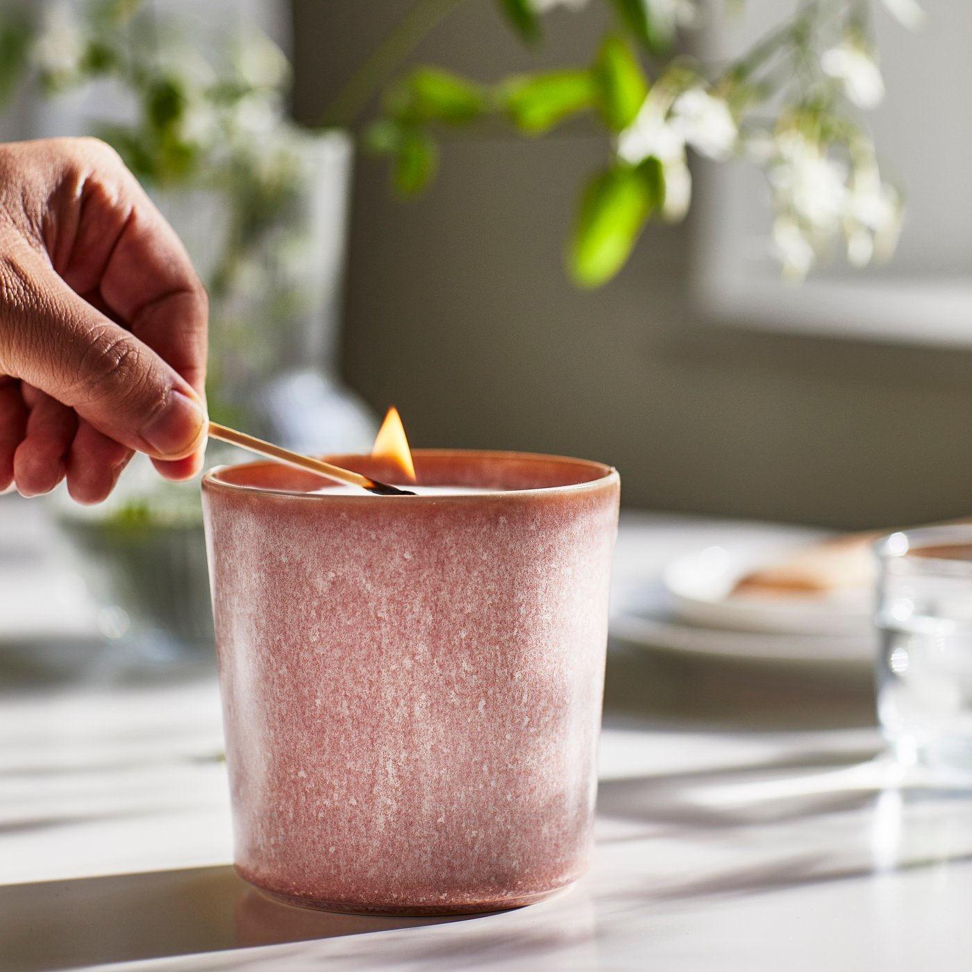 A Jasmine/pink LUGNARE scented candle in ceramic jar