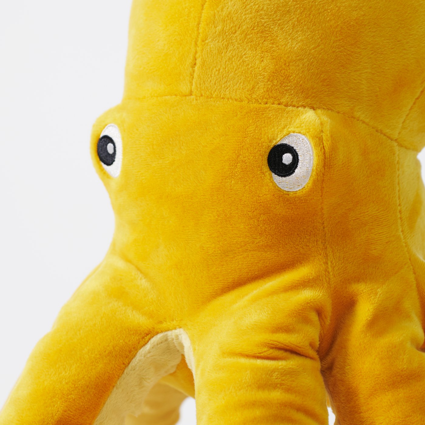 An octopus/yellow BLÅVINGAD soft toy in the NA