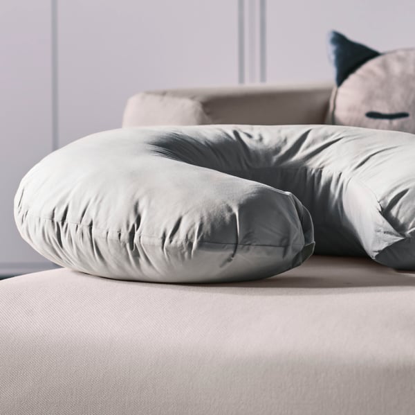 A grey LEN nursing pillow