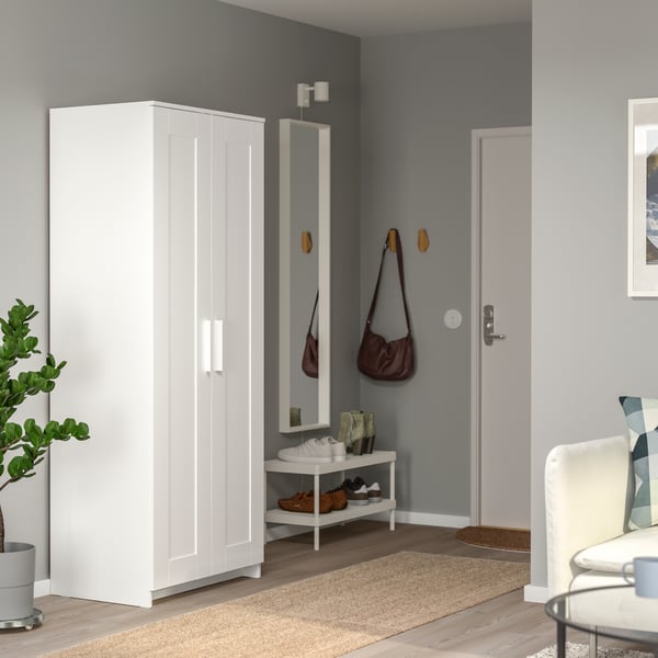 A white TJUSIG shoe rack and a BRIMNES wardrobe.