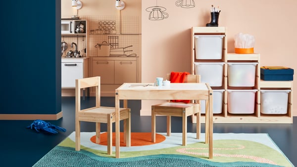 A TROFAST storage with table and chair