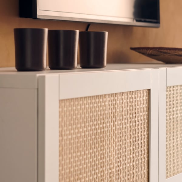 IKEA BESTÅ white/Studsviken white TV bench with doors in the living room.
