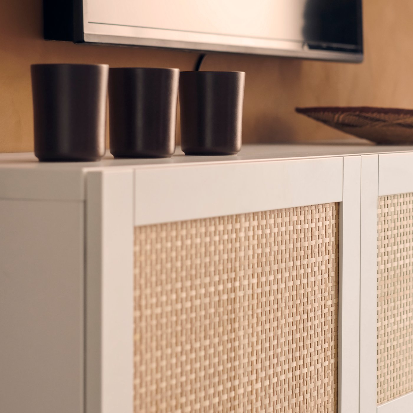 A white/Studsviken white BESTÅ TV bench with doors in the living room