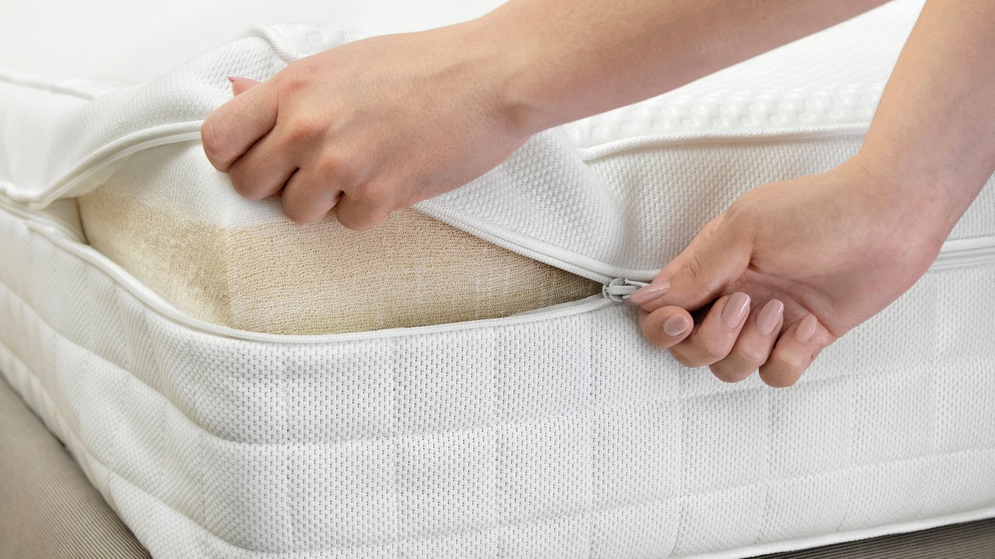 A medium firm/white ÅVABERG foam mattress