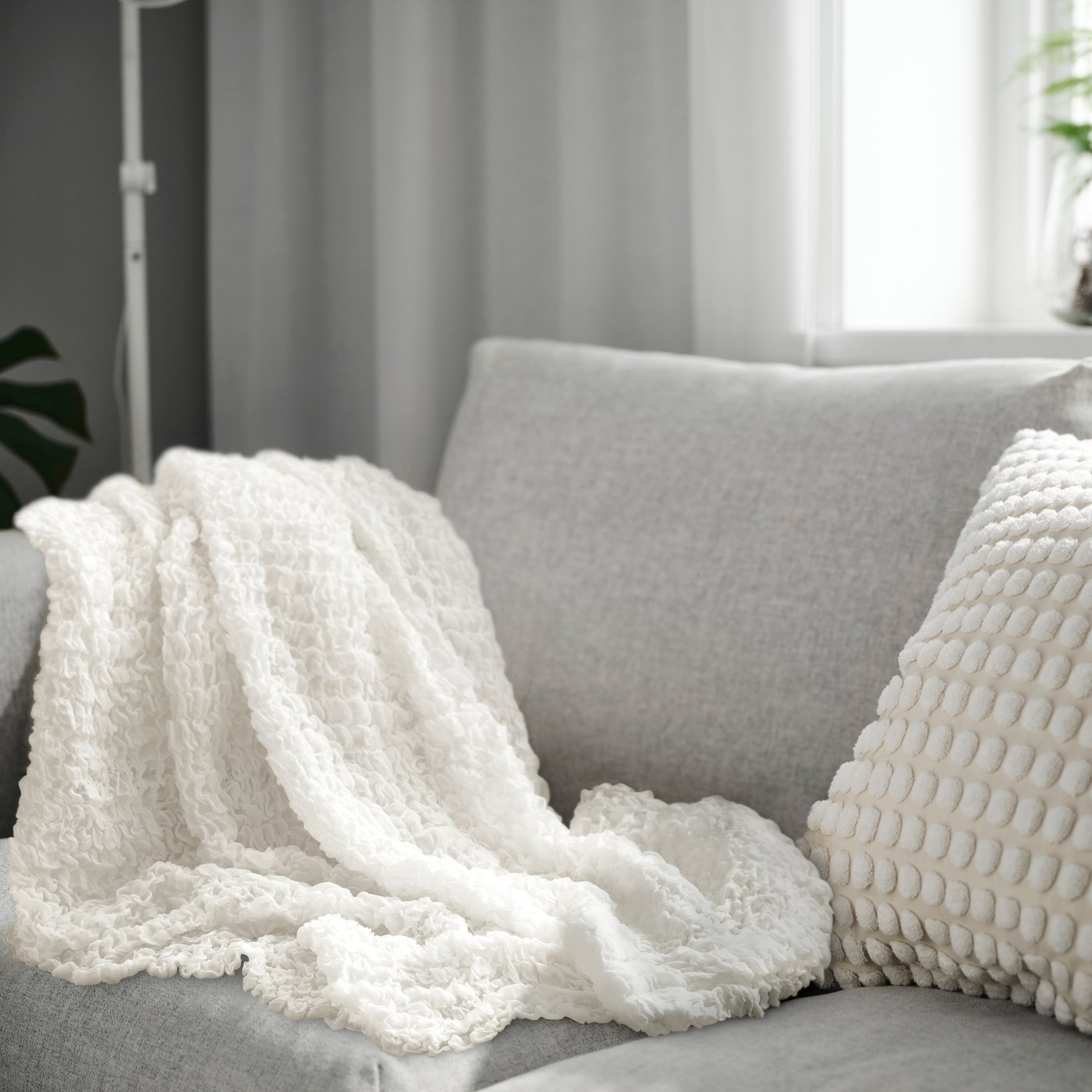 A white OFELIA throw