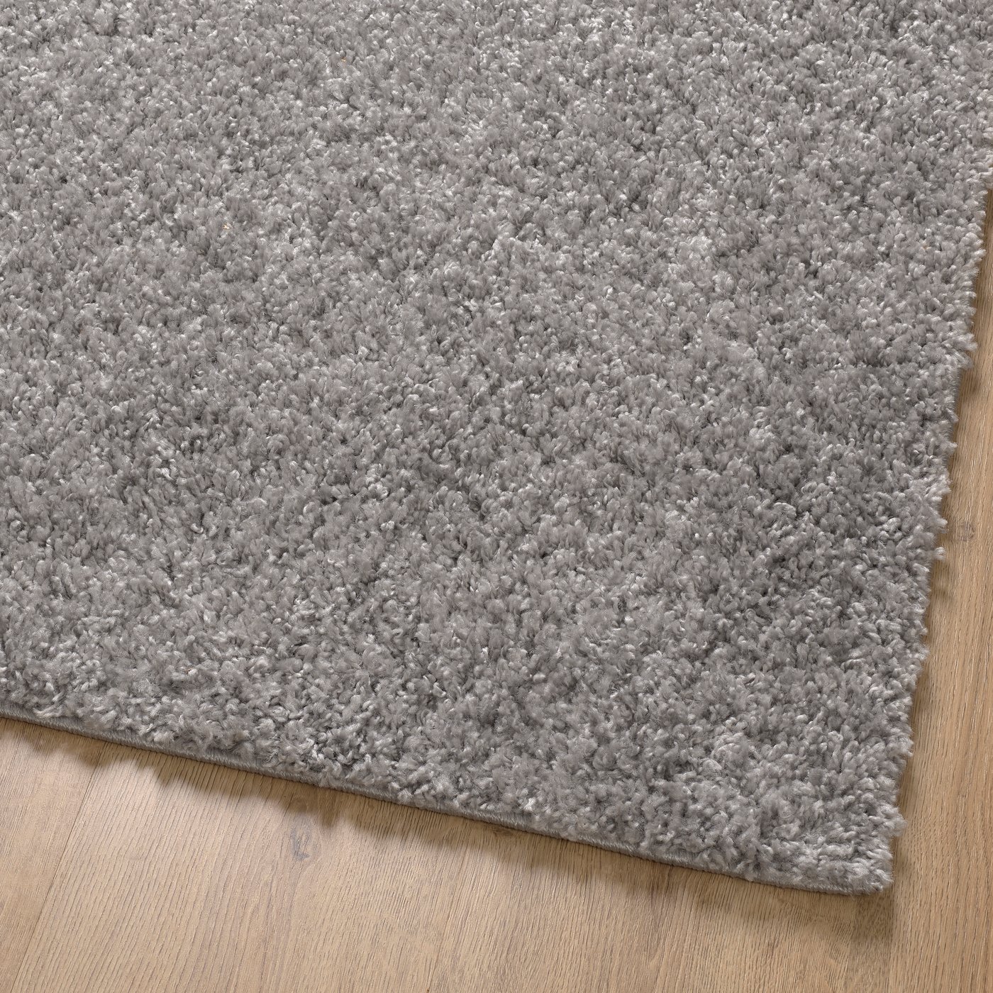 A grey ÄRENDE rug, high pile