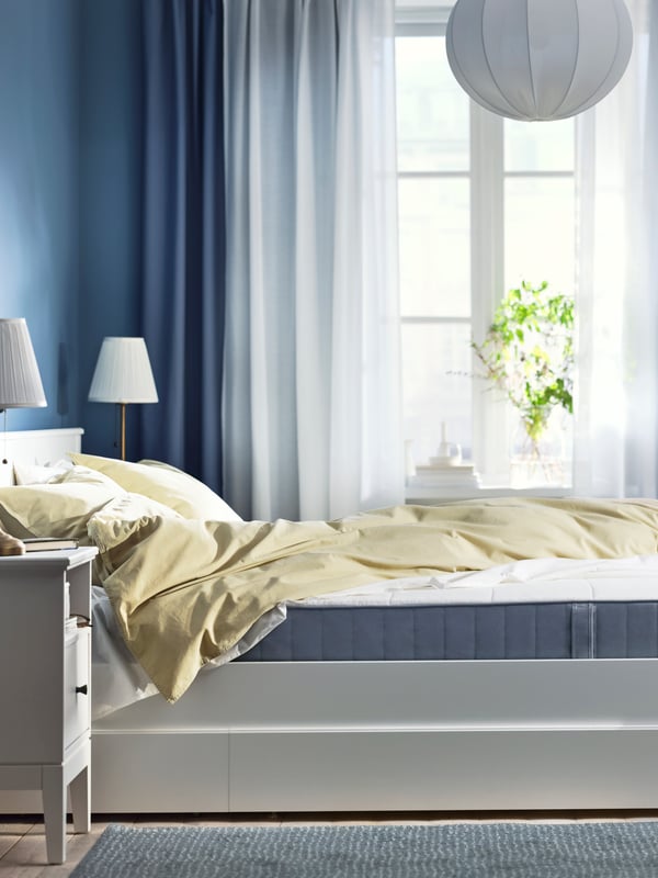 An extra firm/light blue VESTMARKA sprung mattress